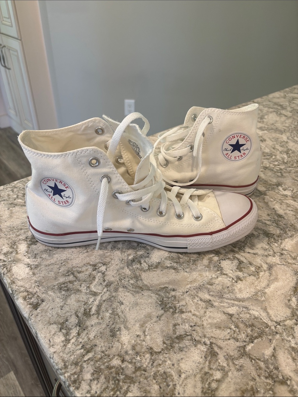Converse Men’s White High Top Chuck Taylor Sneakers with Red Trim